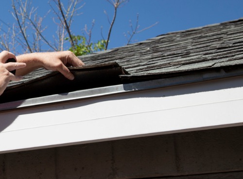 man checking for roof repair