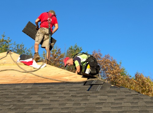 Contractors installing a new roof during Roof Replacement in Central Illinois