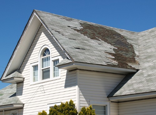 An old roof requiring Roof Repair in Bloomington IL