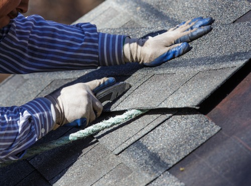 Worker Doing a Roof Installation in Urbana IL