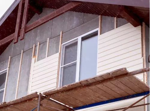 A vinyl siding installation job is seen underway.